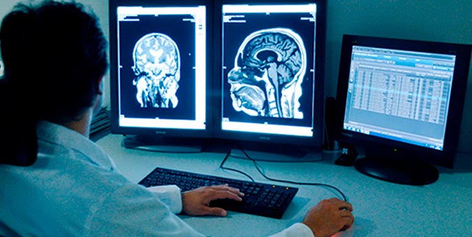 Doctor analyzes test results on a computer
